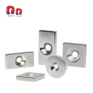 Five silver magnets of varying shapes with a hole in the center, with an inset of two horseshoe magnets.